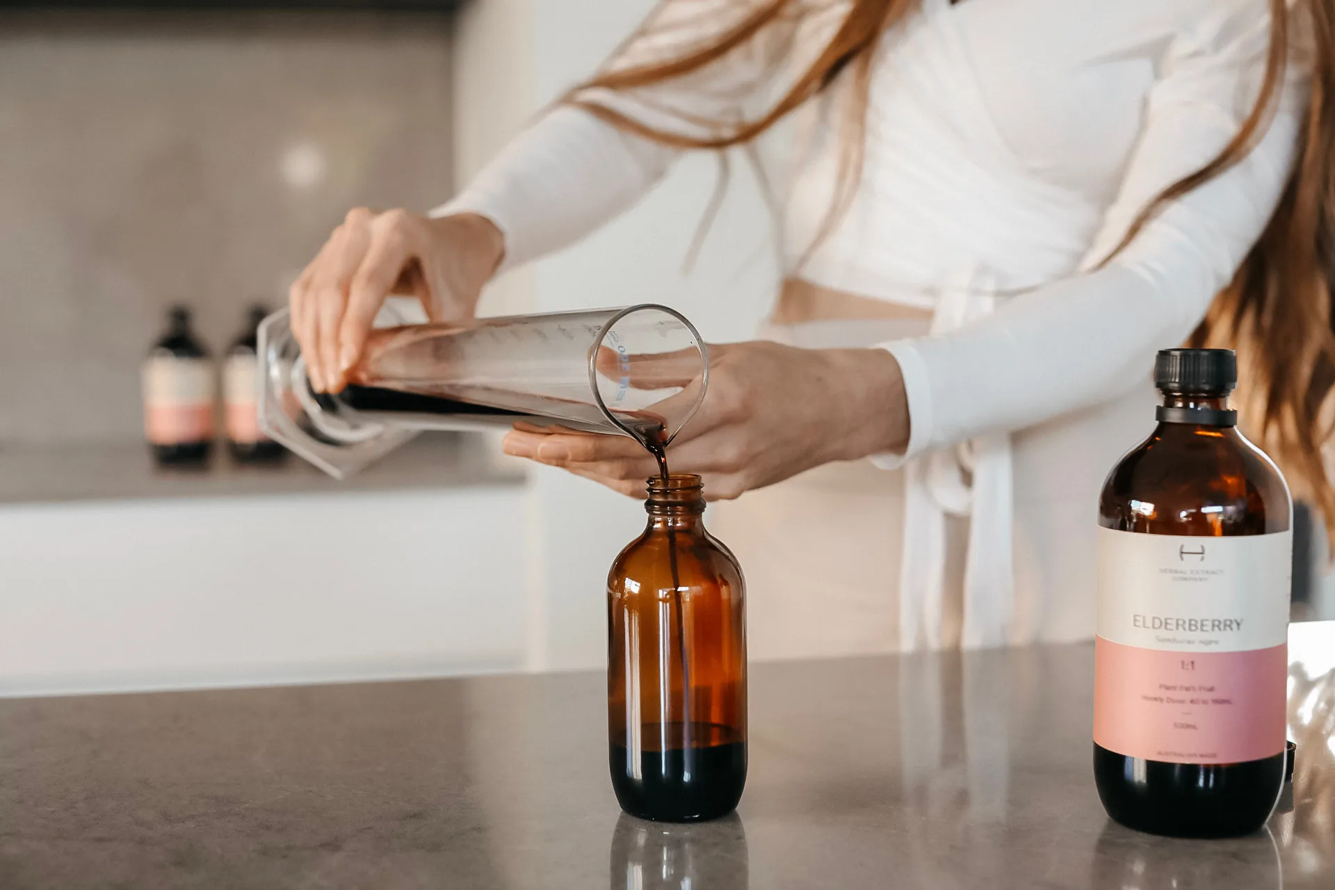 Kathleen preparing herbal tinctures